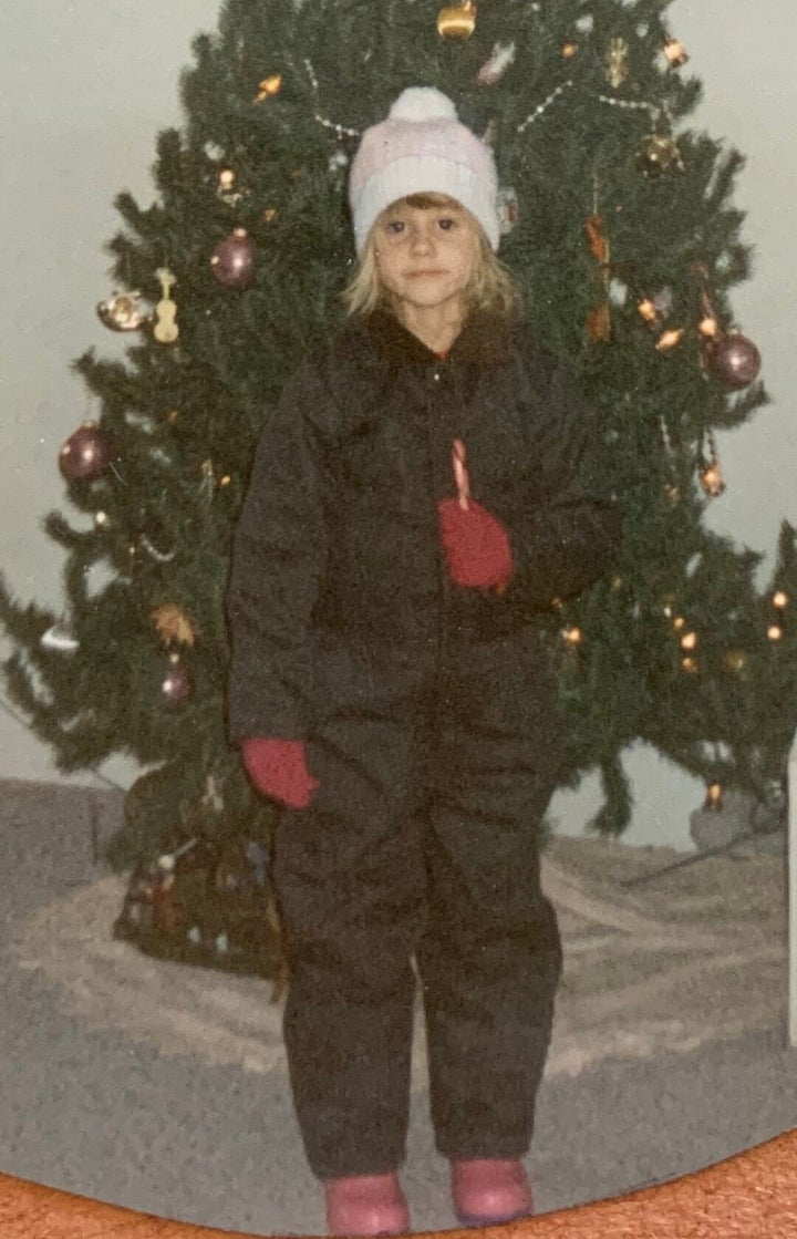 The author, age 7, ready to head outside and explore her family's 50-acre farm.