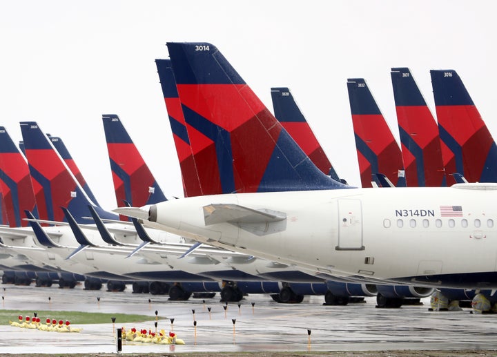 Planes belonging to Delta Air Lines sit idle at Kansas City International Airport on Friday.