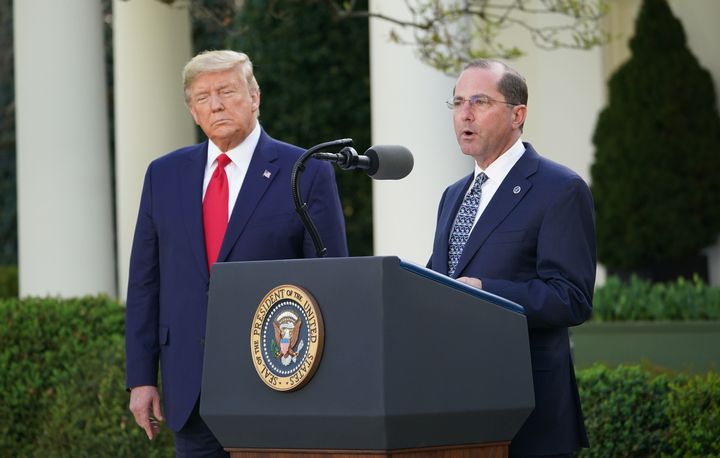 Health and Human Services Secretary Alex Azar with President Donald Trump at a March 30 coronavirus task force briefing in the Rose Garden of the White House.