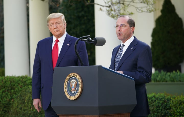 Health and Human Services Secretary Alex Azar with President Donald Trump at a March 30 coronavirus task force briefing in th