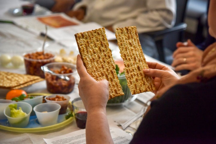 Coronavirus Is Upending Many Of The World’s Biggest Religious Holidays 3 Rabbi Janet Ozur Bass breaks a piece of matzo at an Interfaith Passover seder on April 24, 2019, in Rockville, Maryland.