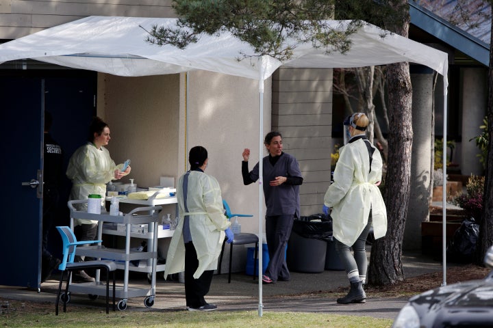 Medical staff prepare for assessing people for novel coronavirus disease at the public Victoria Health Unit in Victoria, B.C. on March 17, 2020.