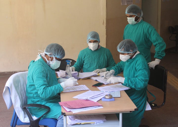 GURUGRAM, INDIA - APRIL 3: Doctors and medical workers in protective face masks and hairnets, on day ten of the national lockdown to curb the spread of coronavirus, at Civil Hospital Sector 10, on April 3, 2020 in Gurugram, India. (Photo by Yogendra Kumar/Hindustan Times)