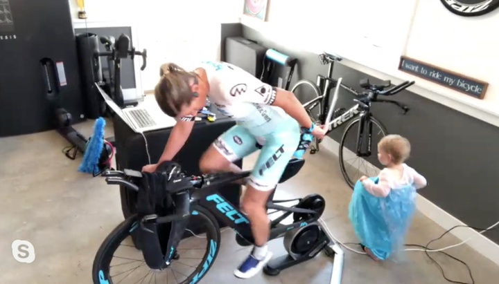 Mirinda Carfrae's toddler amused herself while mom cycled against international champs in the Ironman VR Pro Challenge race.