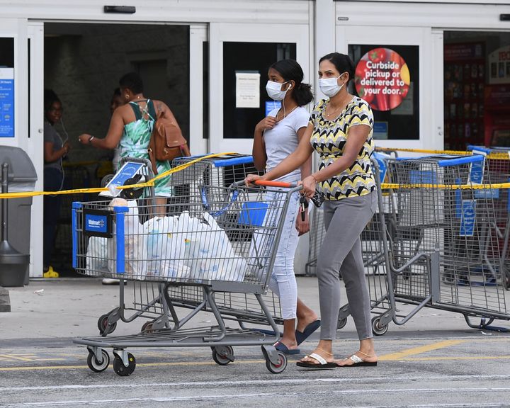 Shoppers at a Walmart in Coconut Creek, Florida, on Saturday as the chain's stores began limiting the number of customers inside.