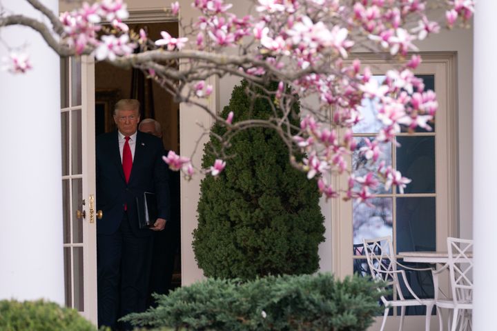 President Donald Trump walks out of the Oval Office for a news conference to declare a national emergency in response to the coronavirus, at the White House, March 13, in Washington.