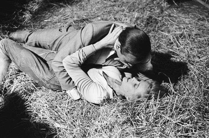 Honor Blackman as Pussy Galore and Sean Connery as James Bond during filming in 1964.