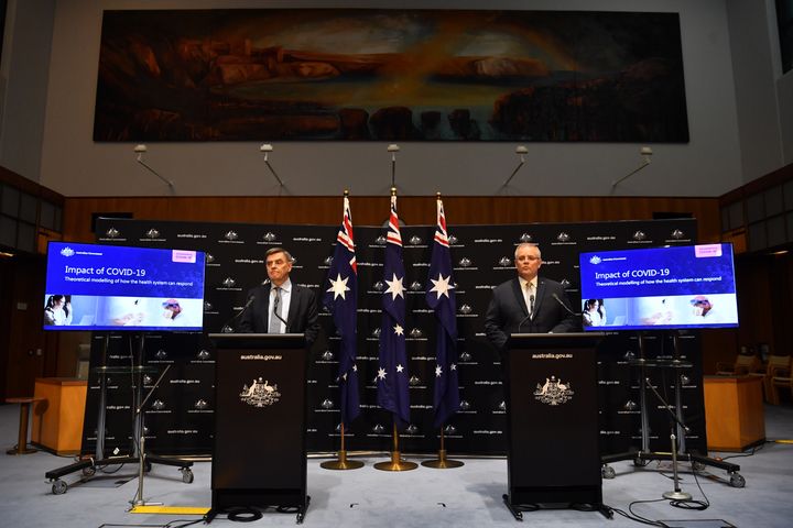 Prime Minister Scott Morrison (right) and Chief Medical Officer Brendan Murphy during a press conference in the Main Committee Room at Parliament House on April 07, 2020 in Canberra, Australia.