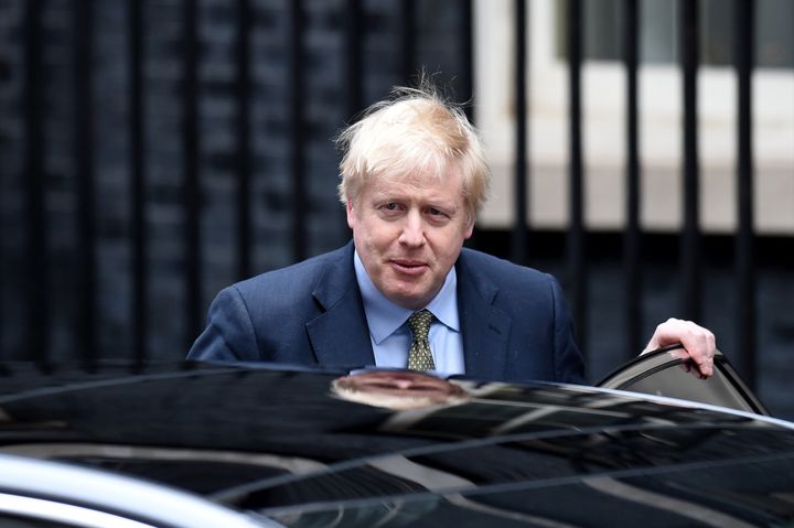 British Prime Minister Boris Johnson is seen here leaving his official residence on London's Downing Street on Dec. 13, 2019. Johnson has tested positive for COVID-19, but No. 10 says he has not been diagnosed with pneumonia as of Tuesday.