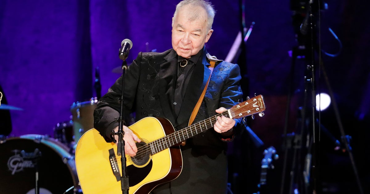 John Prine, Folk Music Legend, Has Died At The Age Of 73, Due To