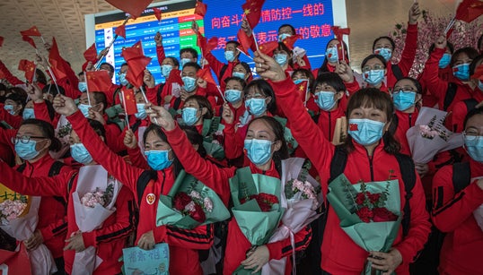Masked Crowds Fill Wuhan’s Streets As Coronavirus Lockdown