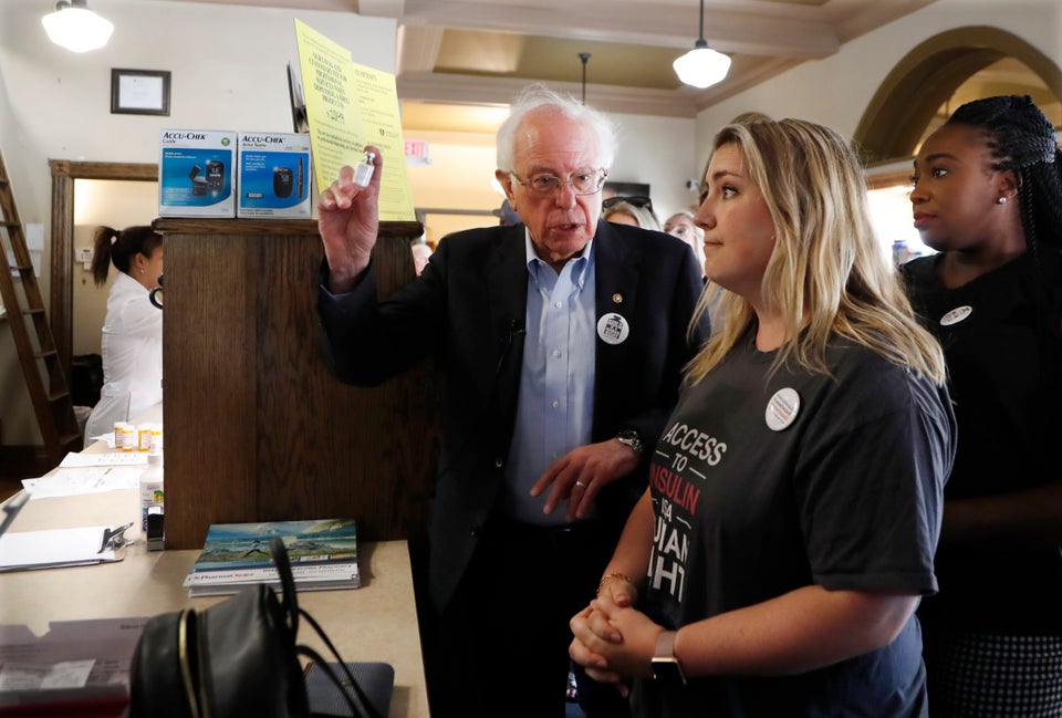 Sanders holds an insulin vial as he talks with Quinn Nystrom at the Olde Walkerville Pharmacy on July...