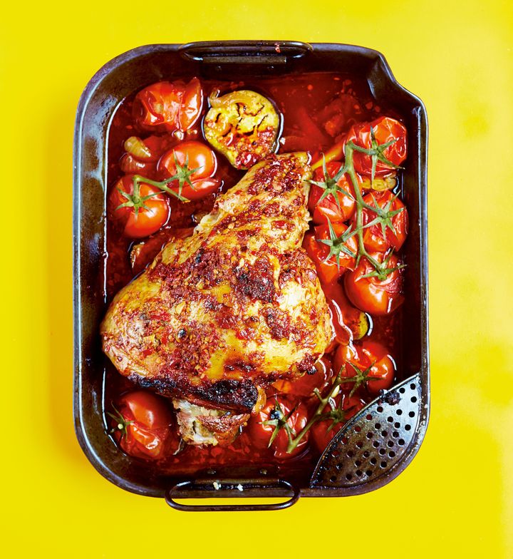 Slow-cooked Leg of Lamb with Harissa, Roasted Aubergines and Tomatoes by Rukmini Iyer from The Roasting Tin, published by Square Peg