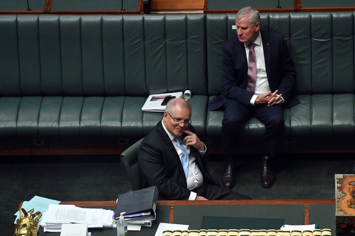 Prime Minister Scott Morrison reacts during a division for amendment to the Coronavirus Economic Response Bill in the House of Representatives at Parliament House on April 08, 2020 in Canberra, Australia. 