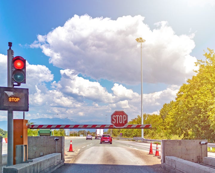 Automatic road barrier, stop, concept: toll road, boom barrier