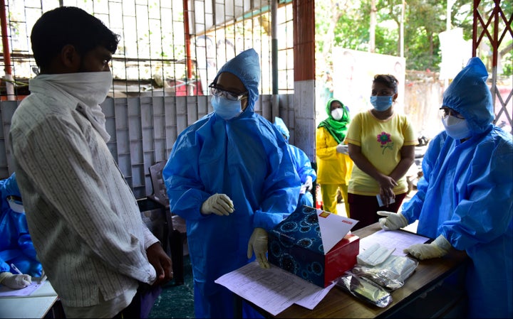 Doctors of Sion Hospital while screening and collecting swab samples of residents.