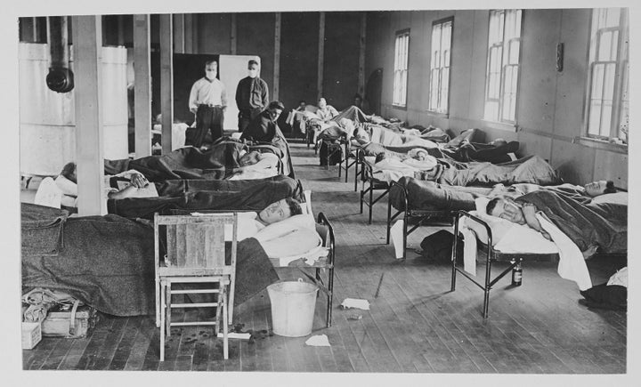 View of victims of the Spanish flu cases as they lie in beads at a barracks hospital on the campus of Colorado Agricultural College, Fort Collins, Colorado, 1918. 