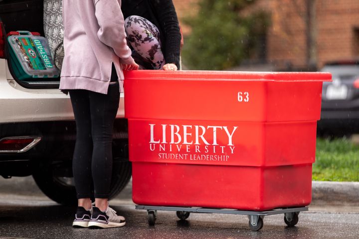 Michelle Gougler, right, helps her daughter Morgan Gougler, a student at Liberty University in Lynchburg, Virginia, move out of her dorm on March 31.