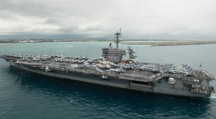 A sailor from the aircraft carrier USS Theodore Roosevelt, pictured, has been moved to a hospital's intensive care unit after contracting the new coronavirus, a Navy official said Thursday.