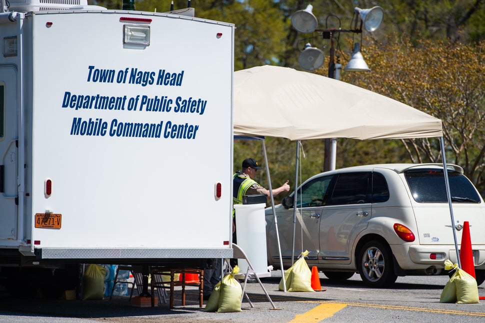 An officer gives a thumbs-up approval for entry into the Outer Banks at the southern end of the Wright Memorial Bridge. 