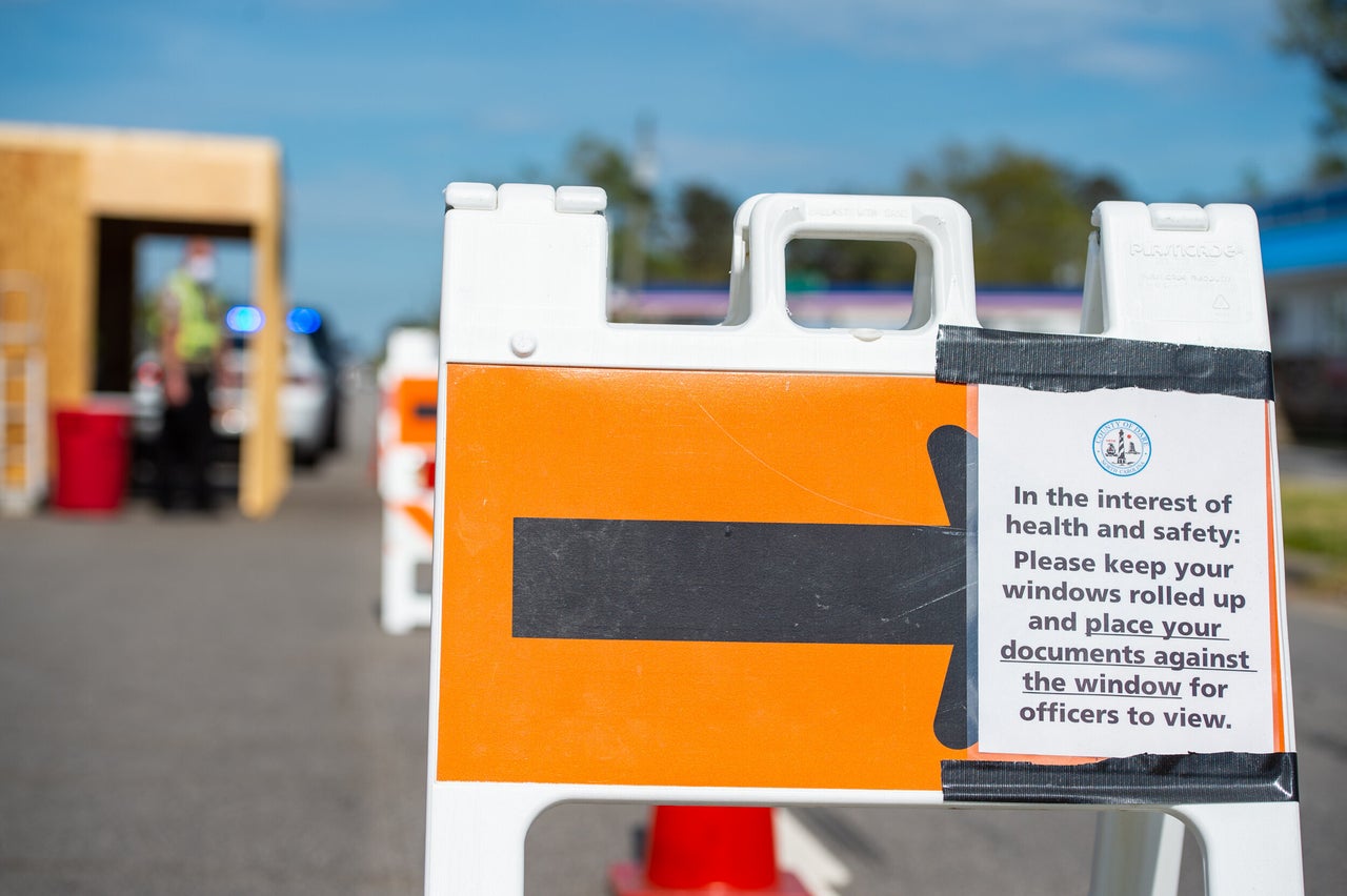 Posted signs alert drivers to safety procedures at this roadblock checkpoint just west of the Virginia Dare Memorial Bridge.