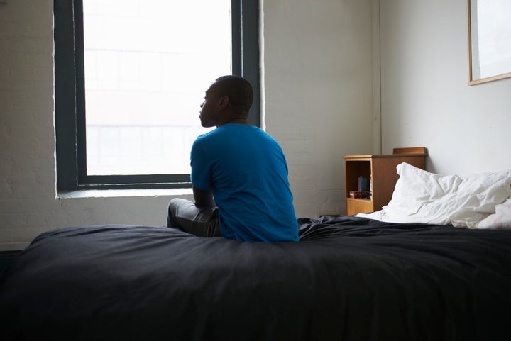 A man sits in a room in a stock photo. The COVID-19 pandemic is making life even more isolating for refugee claimants in Canada. 