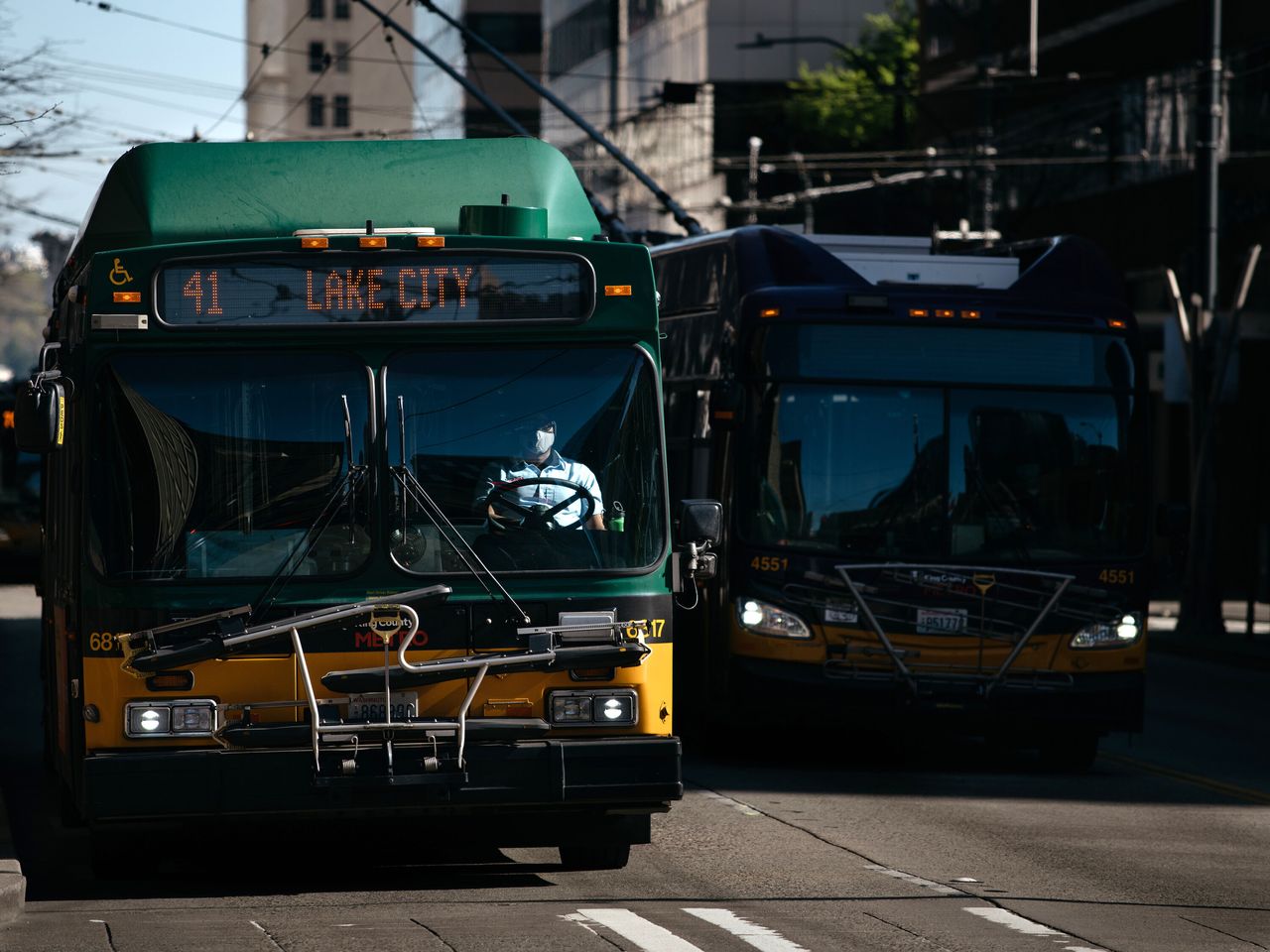 A King County Metro bus driver pilots a bus down a quiet 3rd Avenue, the city’s main bus corridor, when rush hour would normally begin before COVID-19 plagued the area, on April 8, 2020.