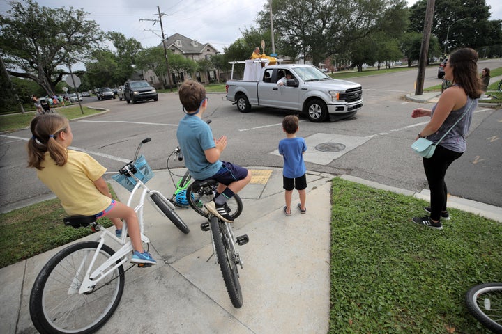 Rev. John G. Restrepo, pastor of St. Dominic Catholic Church, rides in a truck with on Holy Wednesday to bless residents in the Lakeview neighborhood on April 08, 2020 in New Orleans, Louisiana. 