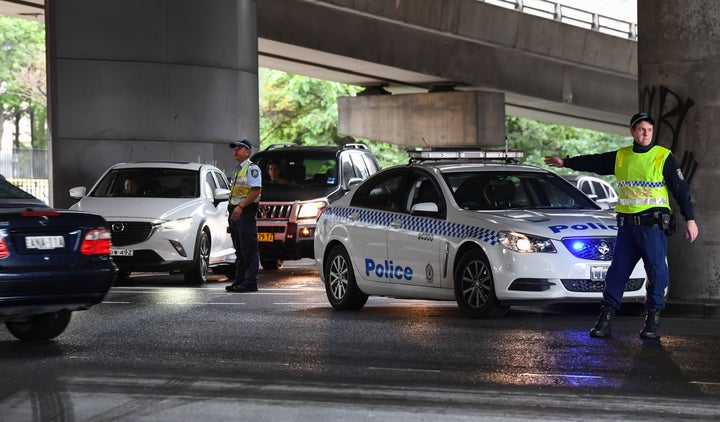 Police control car park entries to ensure safe social distancing at Sydney Fish Market on April 10, 2020 in Sydney, Australia. 