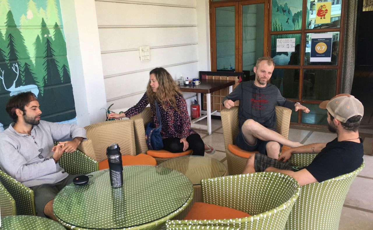 Australian tourist Stewart Dufty, 44, second right, talks with other stranded foreign tourists at a hostel in New Delhi, India, Thursday, April 2, 2020. 