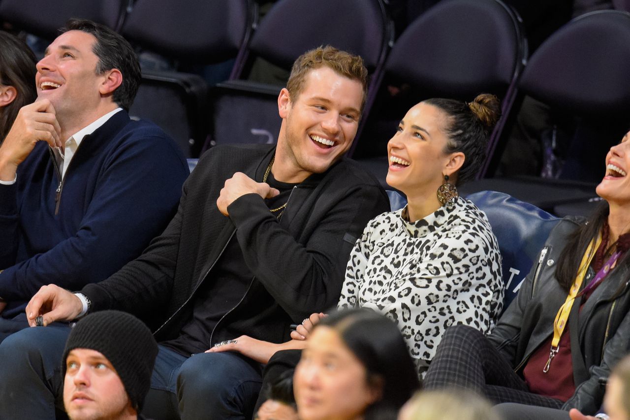 Colton Underwood (L) and Aly Raisman attend a basketball game between the Portland Trail Blazers and the Los Angeles Lakers at Staples Center on January 10, 2017, in Los Angeles, California.