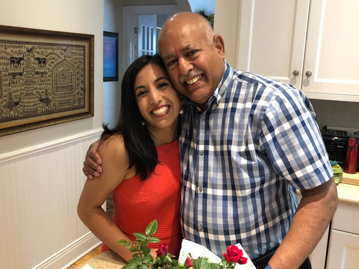 Ishani Nath, left, and her father, Rajeev Nath, share a quick side-hug in June 2019.