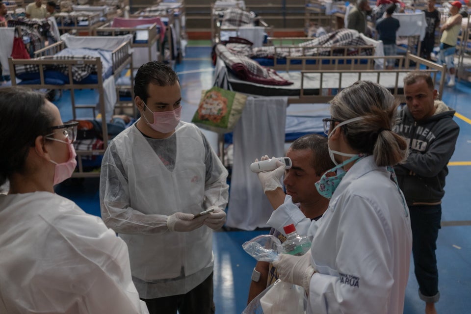 Patients undergo exams conducted by health care workers with Doctors Without
