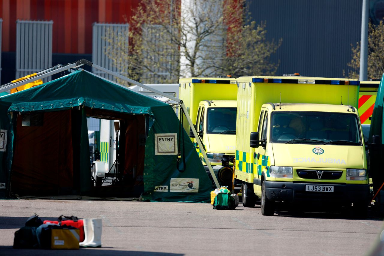 Ambulances parked up outside the ExCeL London exhibition centre, which has been transformed into the "NHS Nightingale" field hospital in London