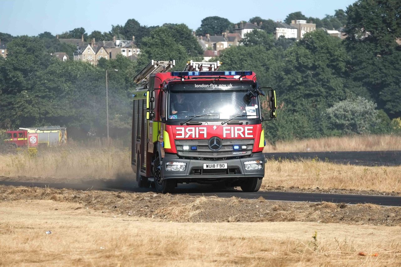 Twenty fire engines and around 125 firefighters tackle a grass fire the size of four football pitches on Woolwich Common, South- East London, UK on July 23, 2018. (Photo by Claire Doherty/Sipa USA)