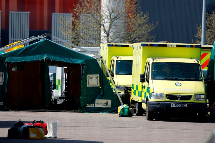 Ambulances are seen parked up outside the Excel in London, which has been transformed into the "NHS Nightingale" field hospital