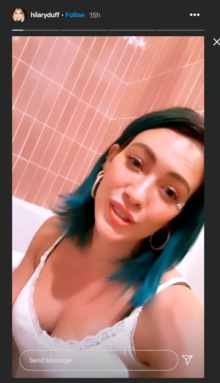Hilary Duff shows off her blue hair while bathing daughter Banks on Instagram Story. 