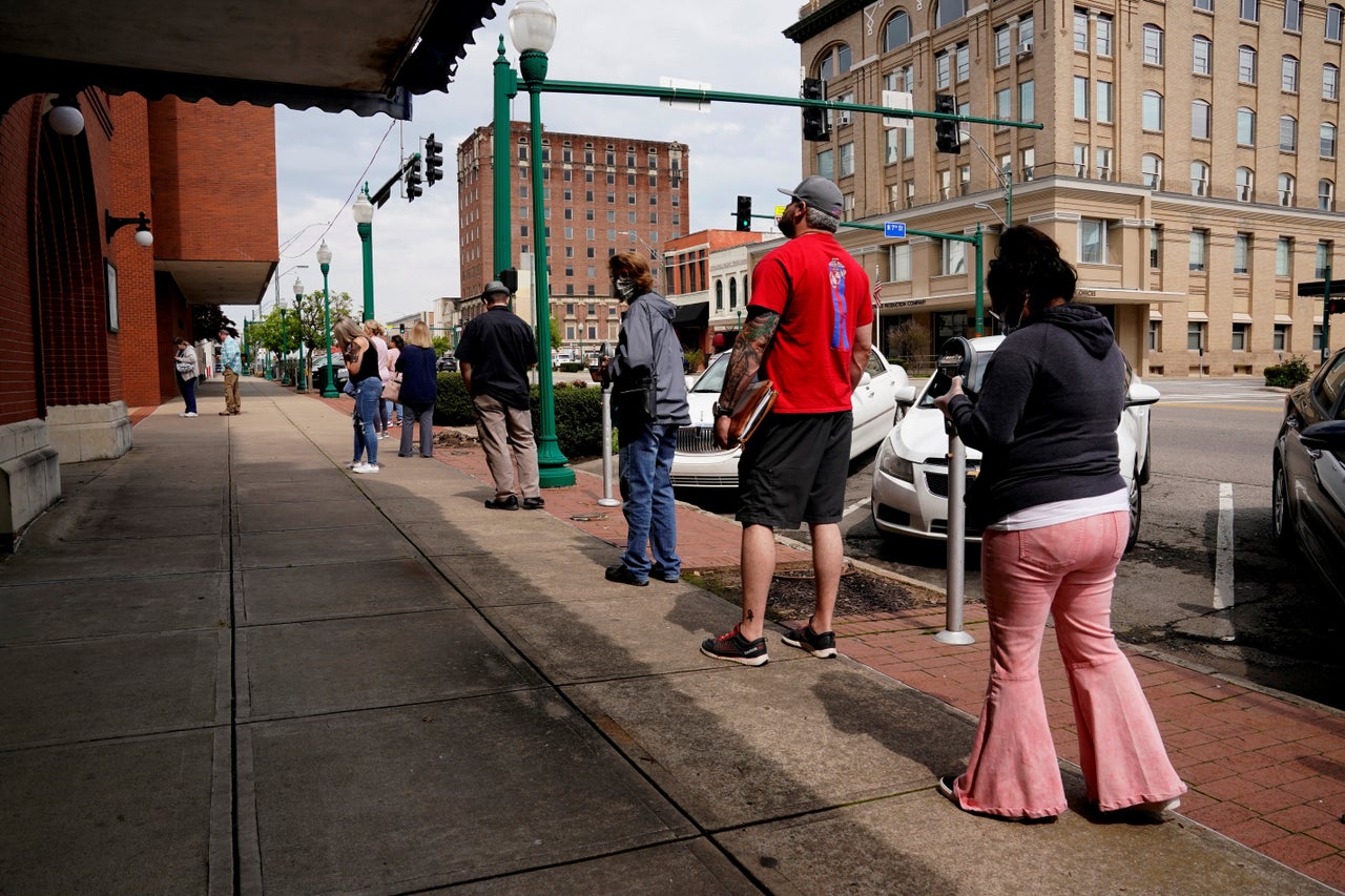 People who lost their jobs wait in line to file for unemployment following the coronavirus outbreak, at an Arkansas Workforce Center in Fort Smith, Arkansas, April 6, 2020.