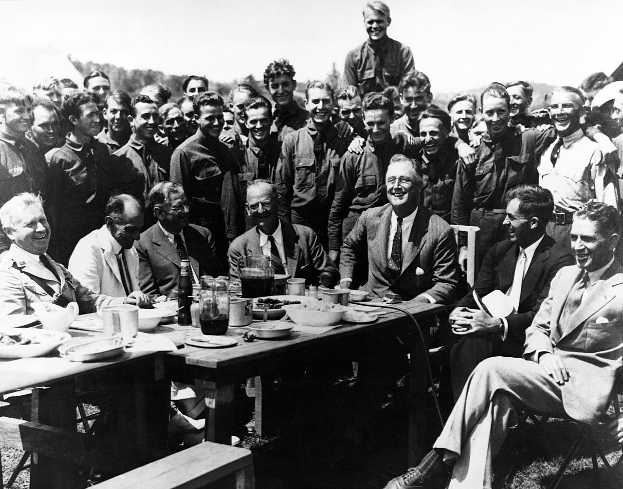 President Franklin Roosevelt visits Civilian Conservation Corps Camp #350 in Virginia's Shenandoah Valley with his aide Rexford Tugwell (far right). The CCC was an example of what the war metaphor's peacetime mobilization looked like in action.