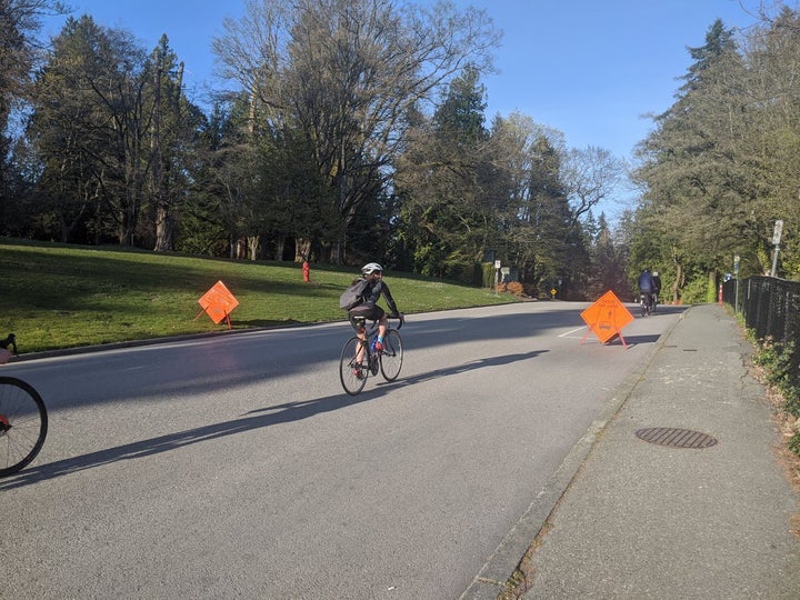 Cyclists take advantage of a closed road in Vancouver's Stanley Park.