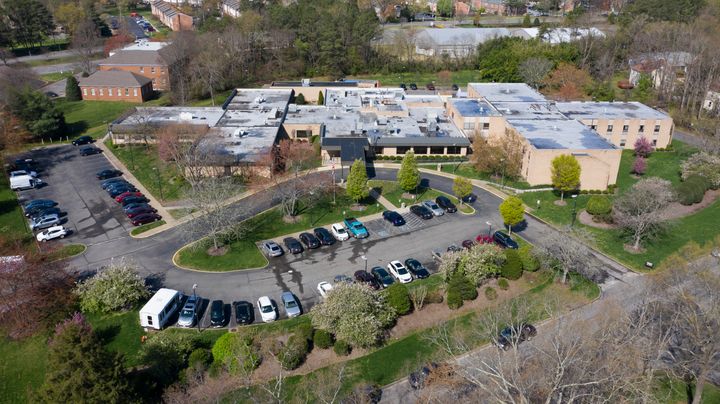 This Friday March 27, 2020 file photo shows the Canterbury Rehabilitation & Healthcare Center in Richmond, Va. Soon after the first coronavirus case hit the rehabilitation facility, many of the staffers quit.