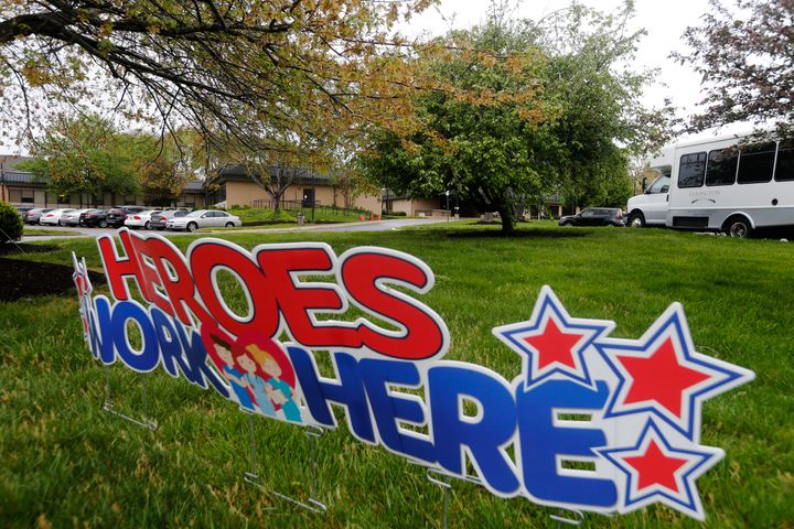 This April 8, 2020 file photo shows a sign stating the 'Heroes Work Here' has been placed in the grounds of the Canterbury Rehabilitation & Healthcare Center in Richmond, Va. 