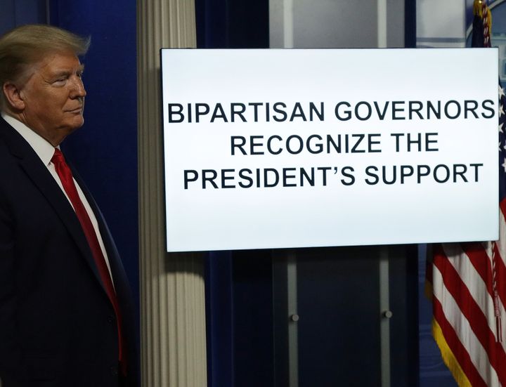 President Donald Trump stands next to a monitor playing a video during the briefing of the White House Coronavirus Task Force, April 13, in Washington, D.C. On Monday, Trump tweeted that he will be the one to make the decision to reopen the states in conjunction with governors and input from others.