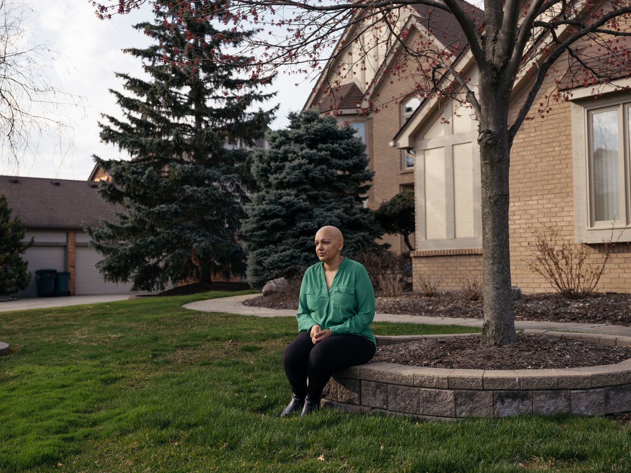 Sveta Desai sits outside her home in Troy, Michigan. Due to the coronavirus pandemic, her breast cancer surgery has been postponed.