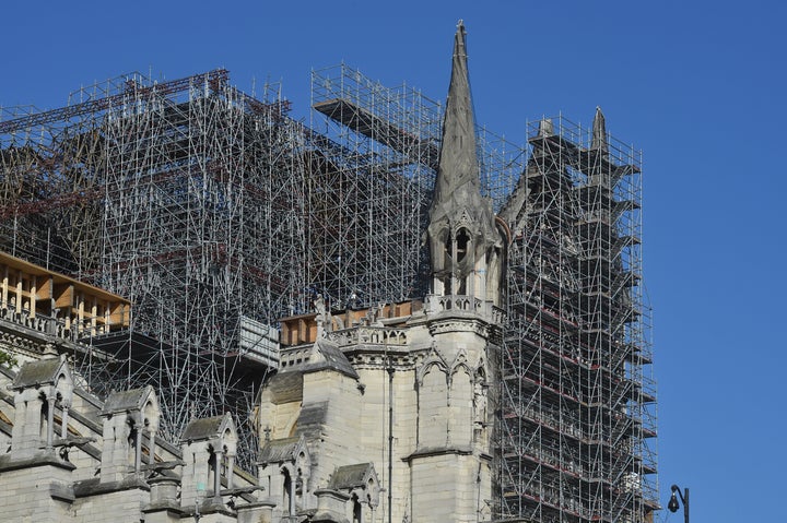 The scaffolding of Notre-Dame Cathedral is seen after repair work stops due to the coronavirus outbreak one year after fire r
