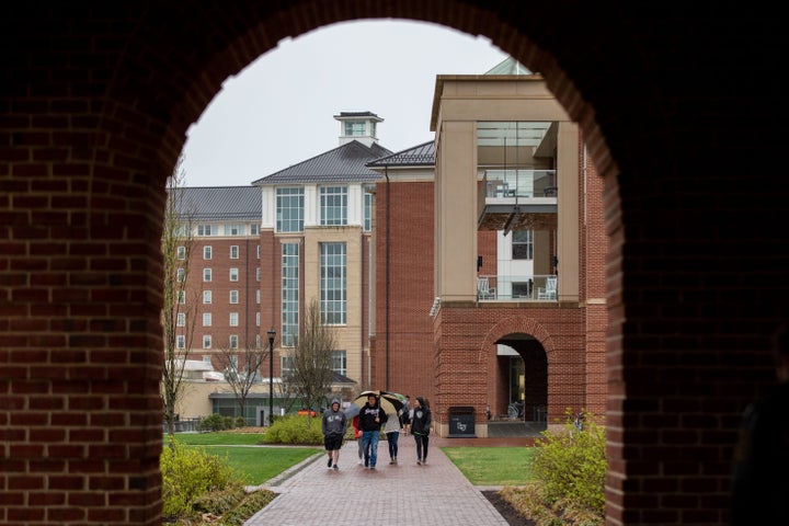 Students walk around the campus of Liberty University in Lynchburg, Virginia, on March 31, 2020.