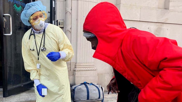 Asha Shajahan screens a homeless person in Detroit, Michigan.