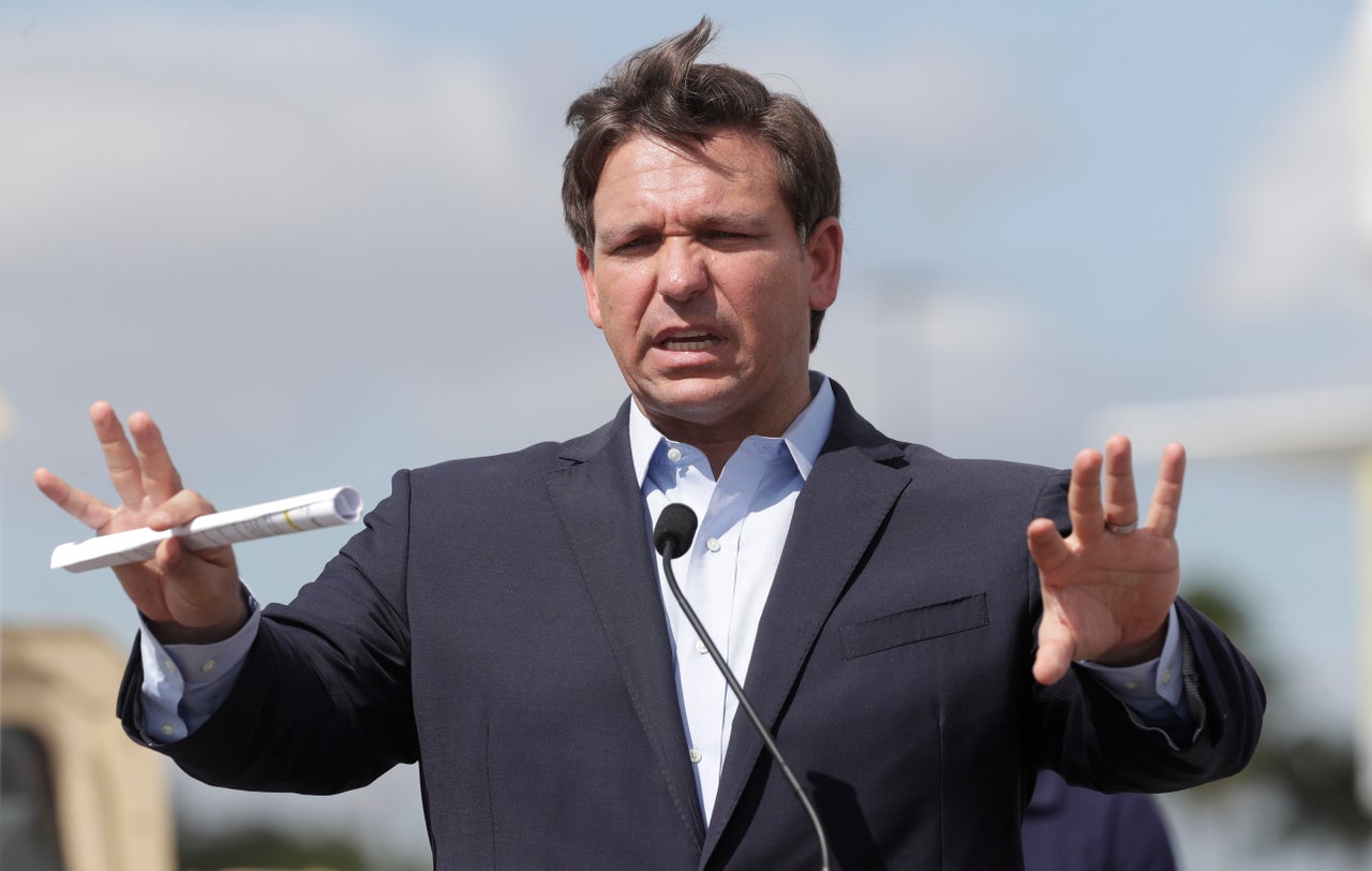 Florida Gov. Ron DeSantis speaks at a drive-through coronavirus testing site in Miami Gardens.