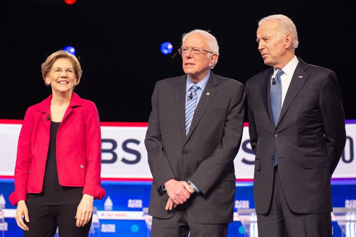 From left to right, U.S. Sen. Elizabeth Warren, U.S. Sen. Bernie Sanders and former U.S. vice-president Joe Biden stand on stage for a Democratic debate in Charleston, S.C., on Feb. 25, 2020. 