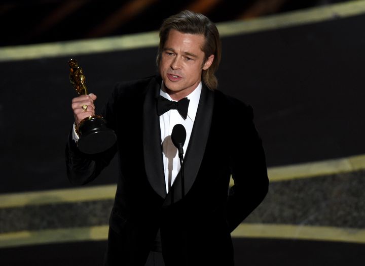 Brad Pitt accepts the award for best performance by an actor in a supporting role at the Oscars on Feb. 9.